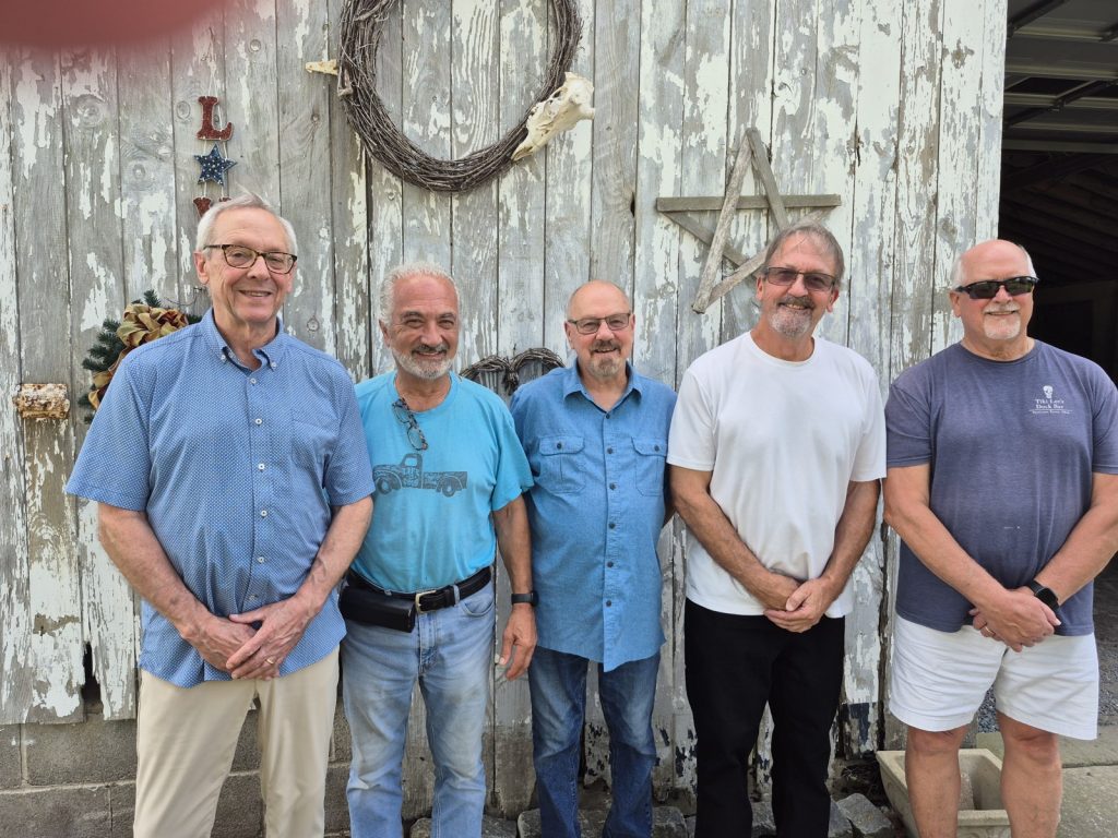 REUNION Band photographed together outdoors